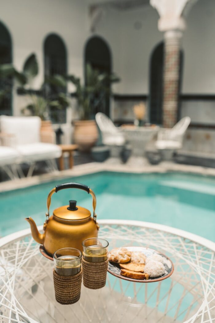 gold teapot on white round table