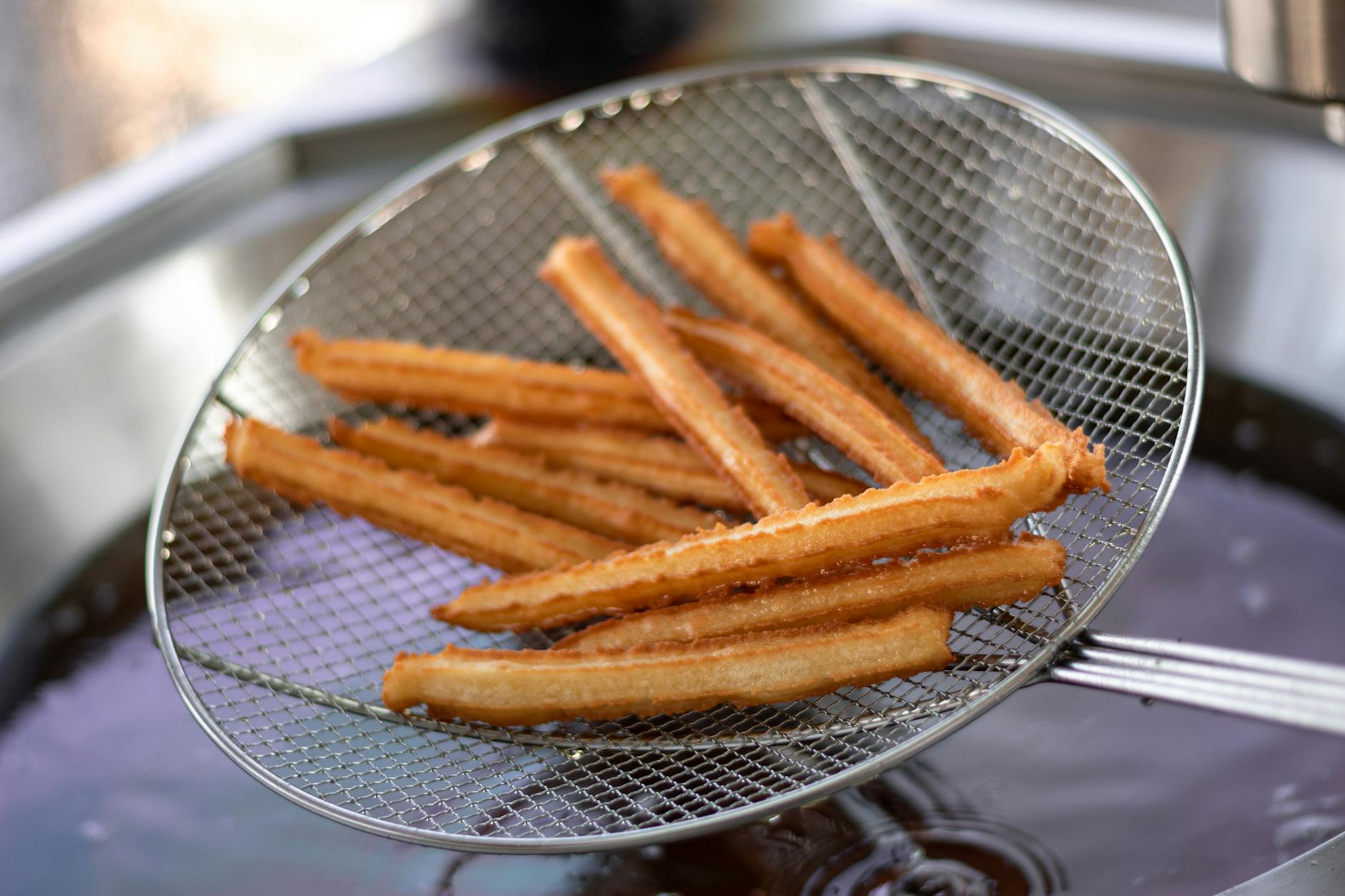 churros on stainless steel strainer