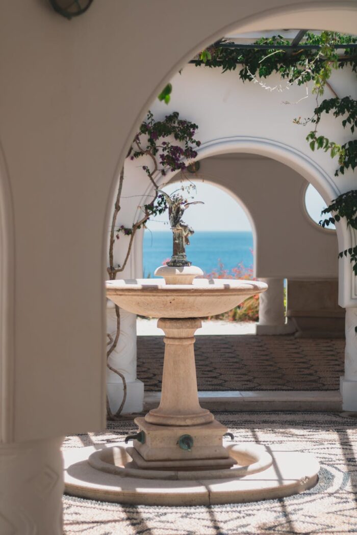 fountain near arched entrance