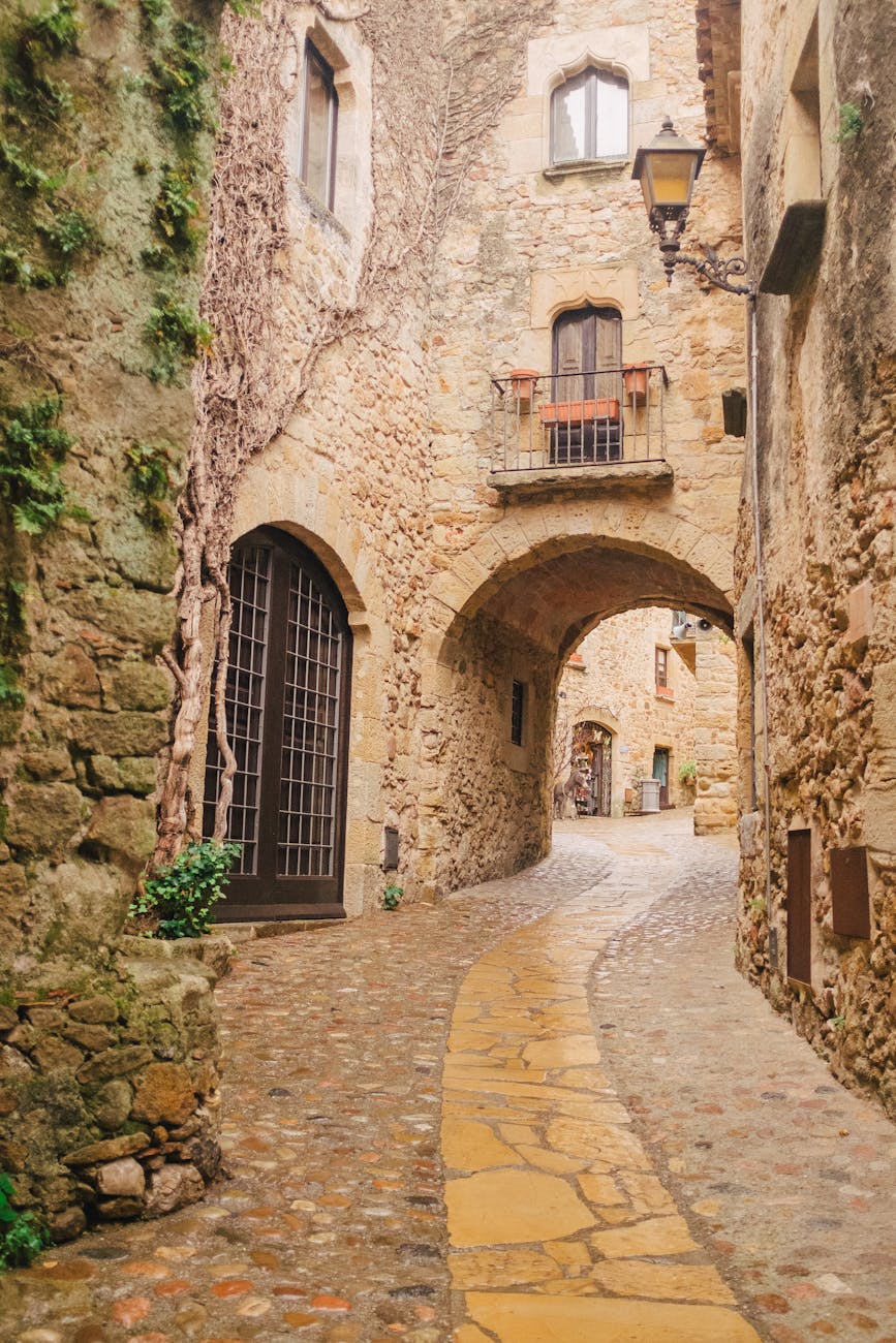 photograph of a road between rock buildings